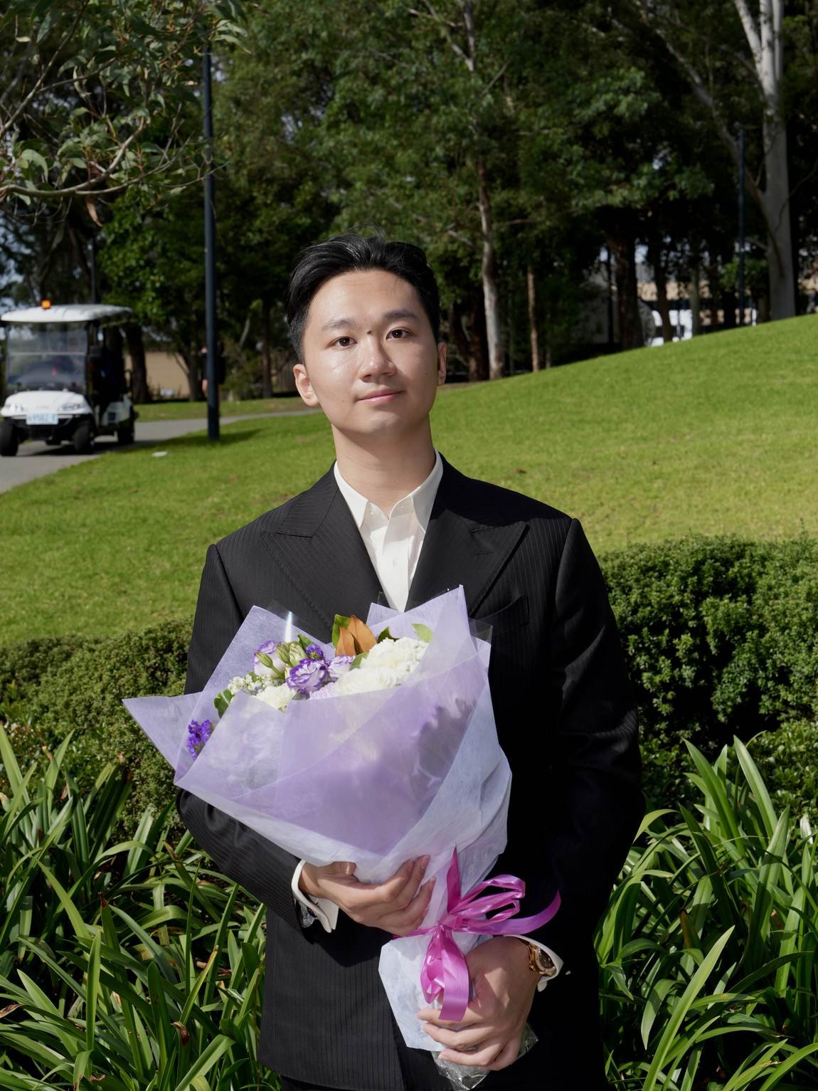 Portrait of John Nguyen in a dark suit